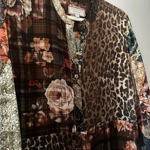 Johnny was silk dress! Beautiful print. Fit is very flattering.